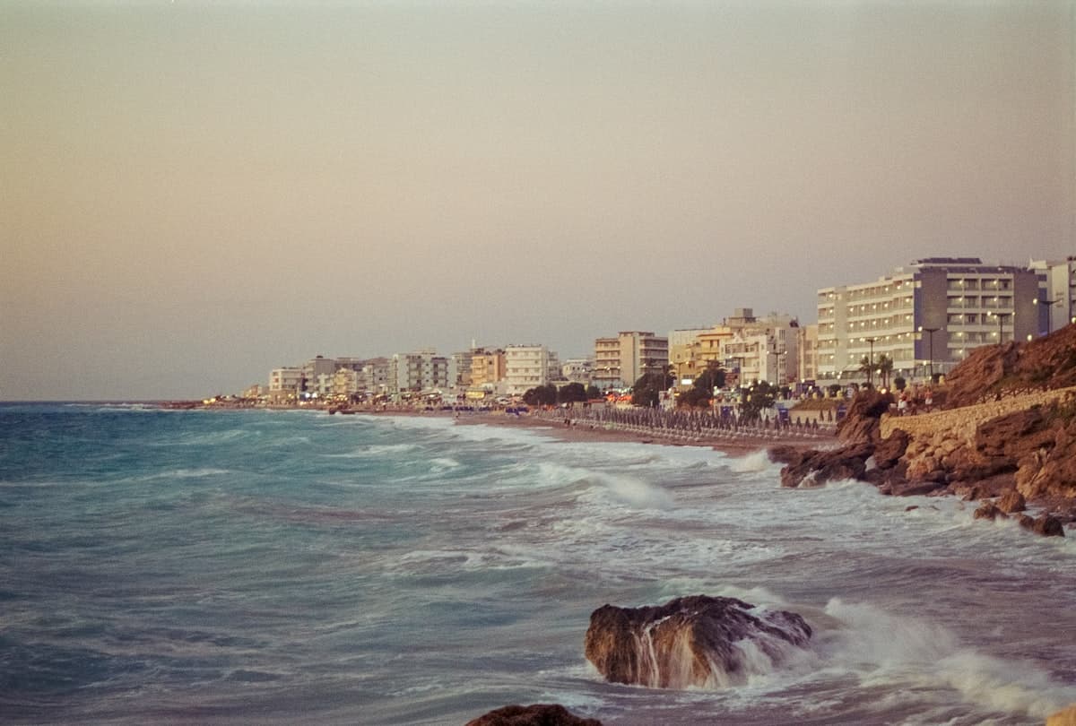 A view of a beach with buildings in the background