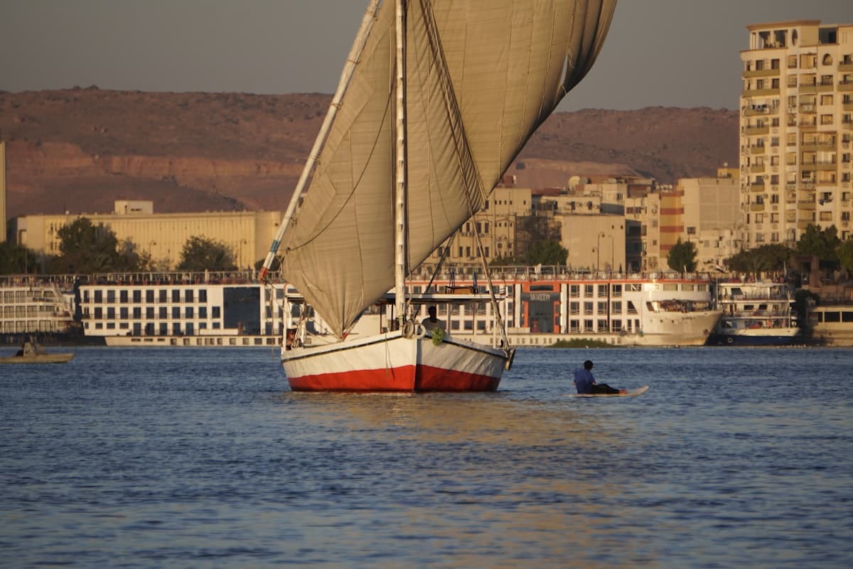 A sailboat sailing on a body of water