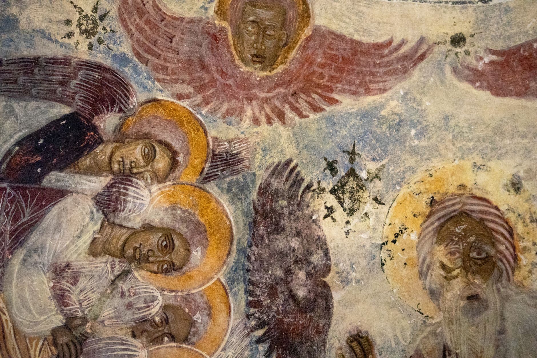 Intricate fresco depicting angels and saints in a historic Trabzon church.
