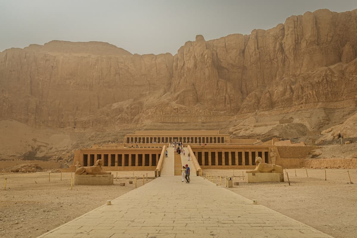 Ancient egyptian temple complex in a desert landscape.