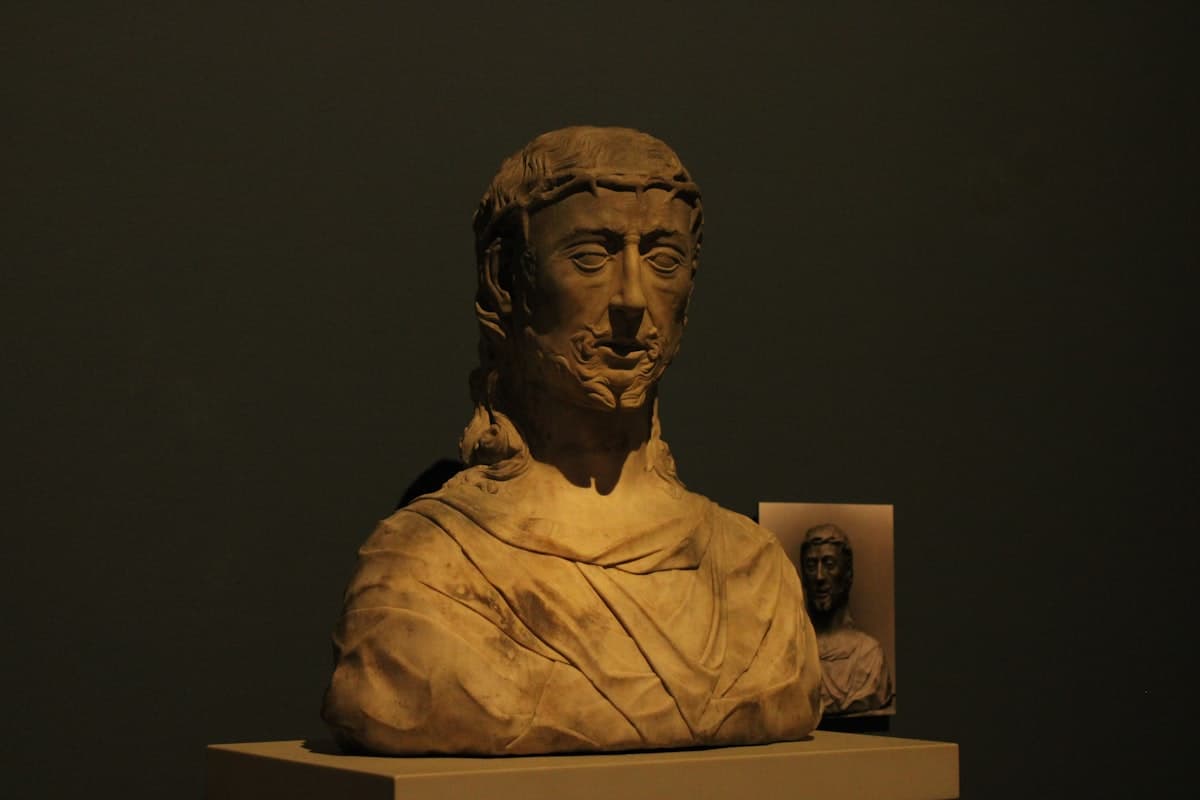 Marble bust of a man with a laurel wreath.