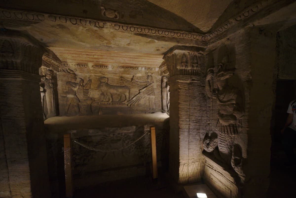 A room with a bed and a table in it