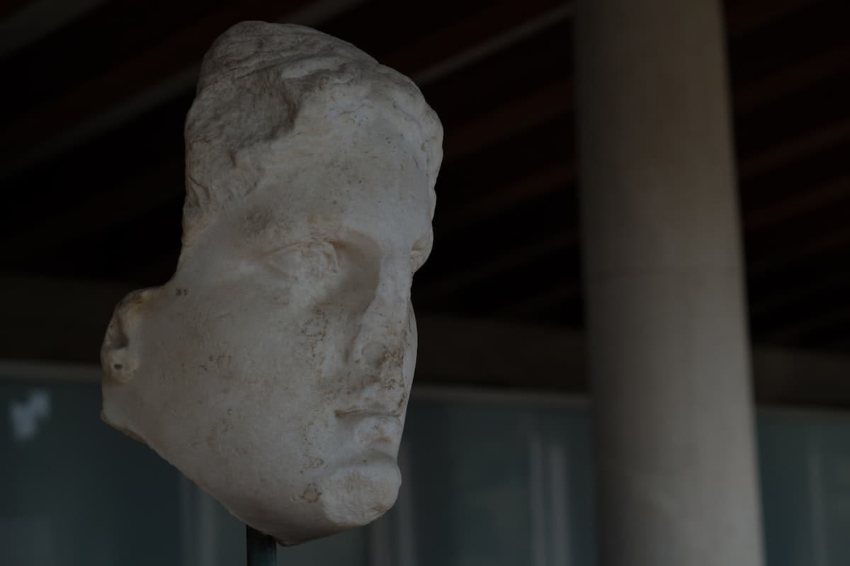 a statue of a man's head on a stick