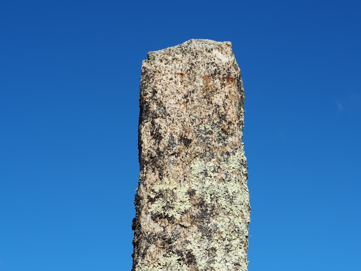 a large rock sticking out of the ground