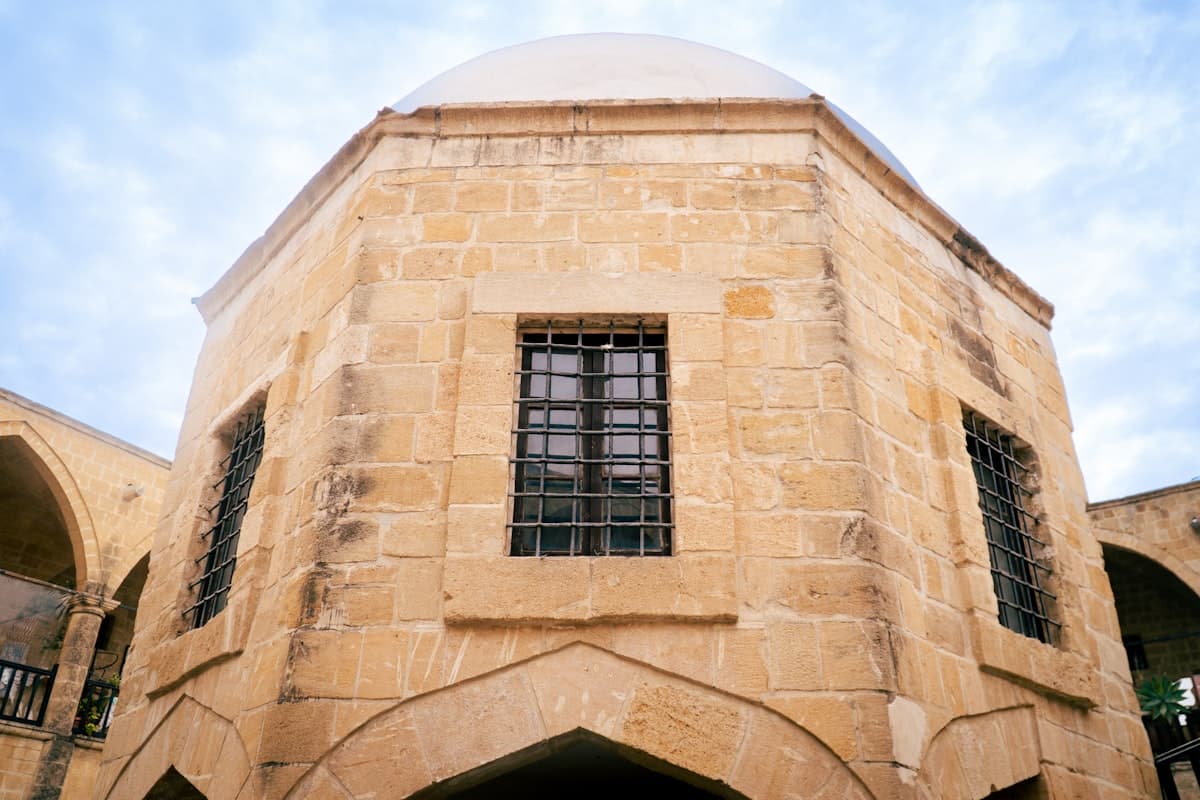 Octagonal stone building with a domed roof.