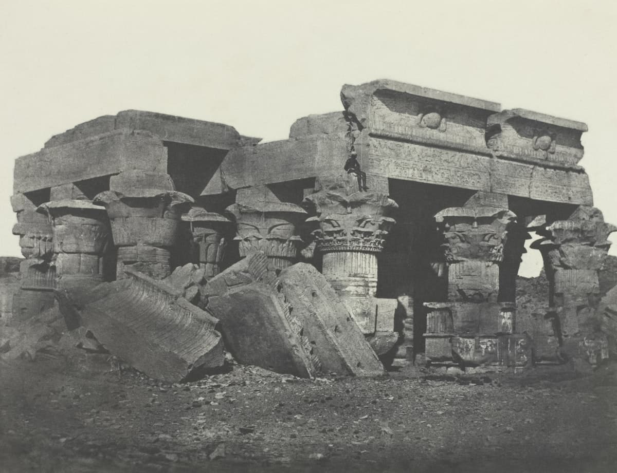 Ancient egyptian temple ruins with fallen columns