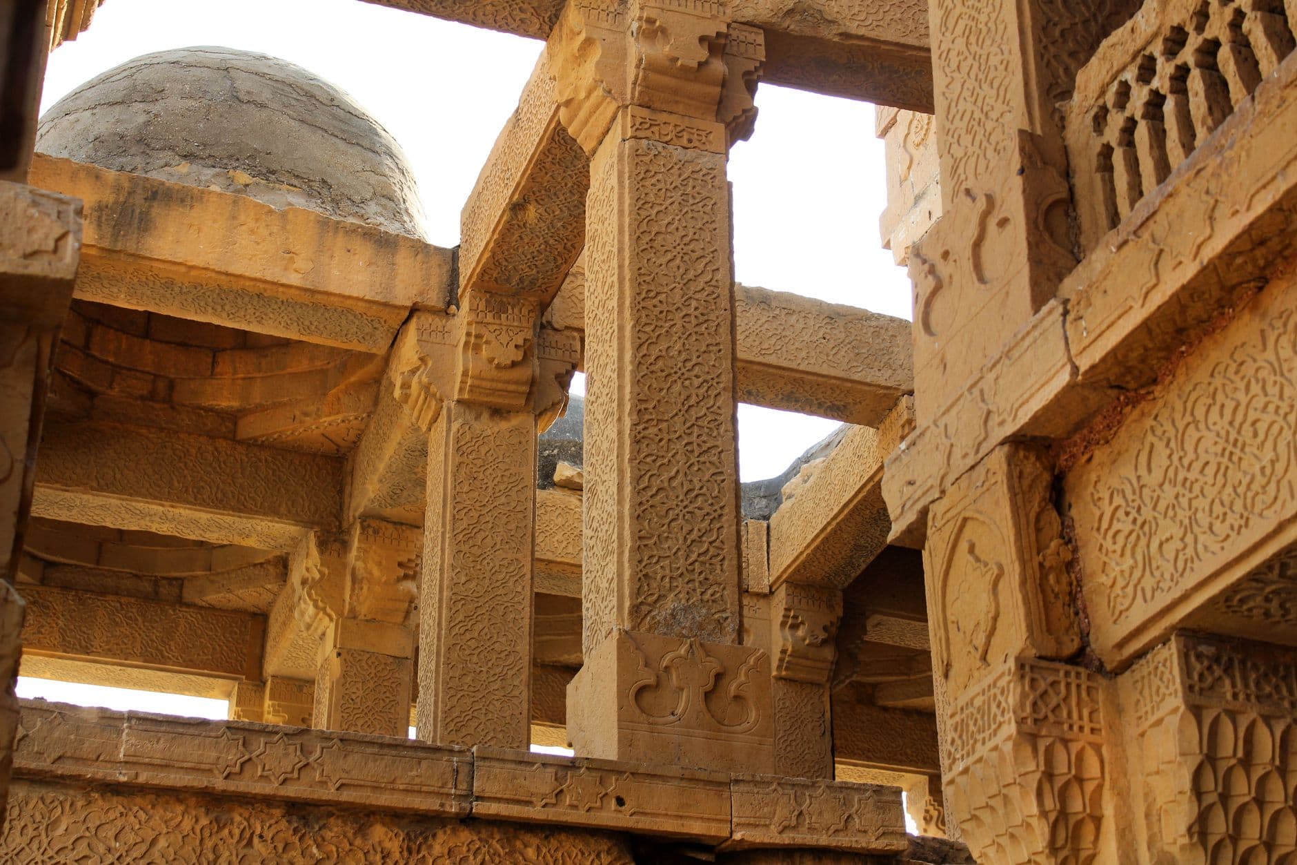 Intricately carved stone structures at Makli Necropolis in Sindh, Pakistan, showcase rich architectural heritage.