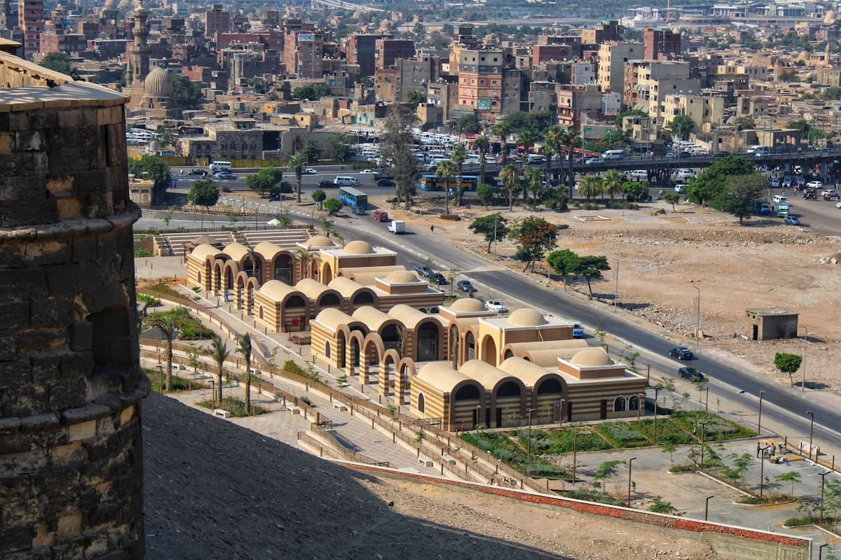 Historic buildings with city skyline in background