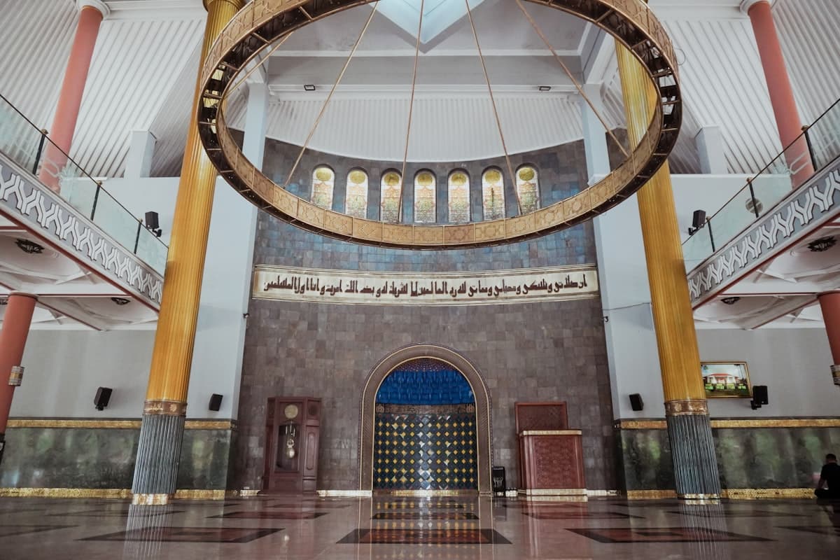 Interior of a grand mosque with large chandelier