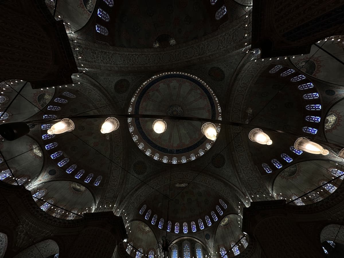 the ceiling of a large building with many lights