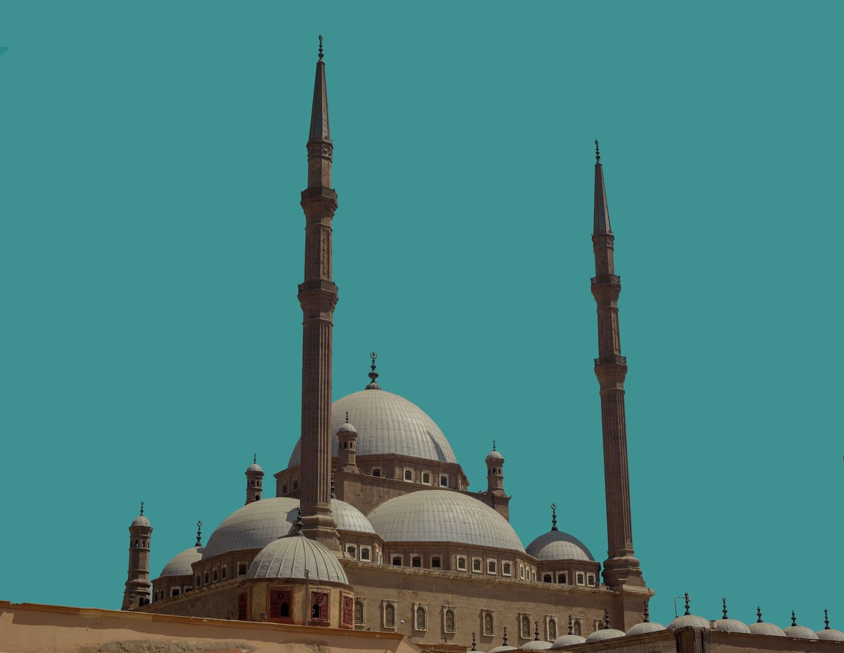 Captivating view of the Mosque of Muhammad Ali in Cairo against a vibrant blue sky.