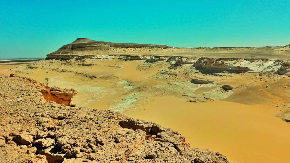 brown rock formation under blue sky during daytime