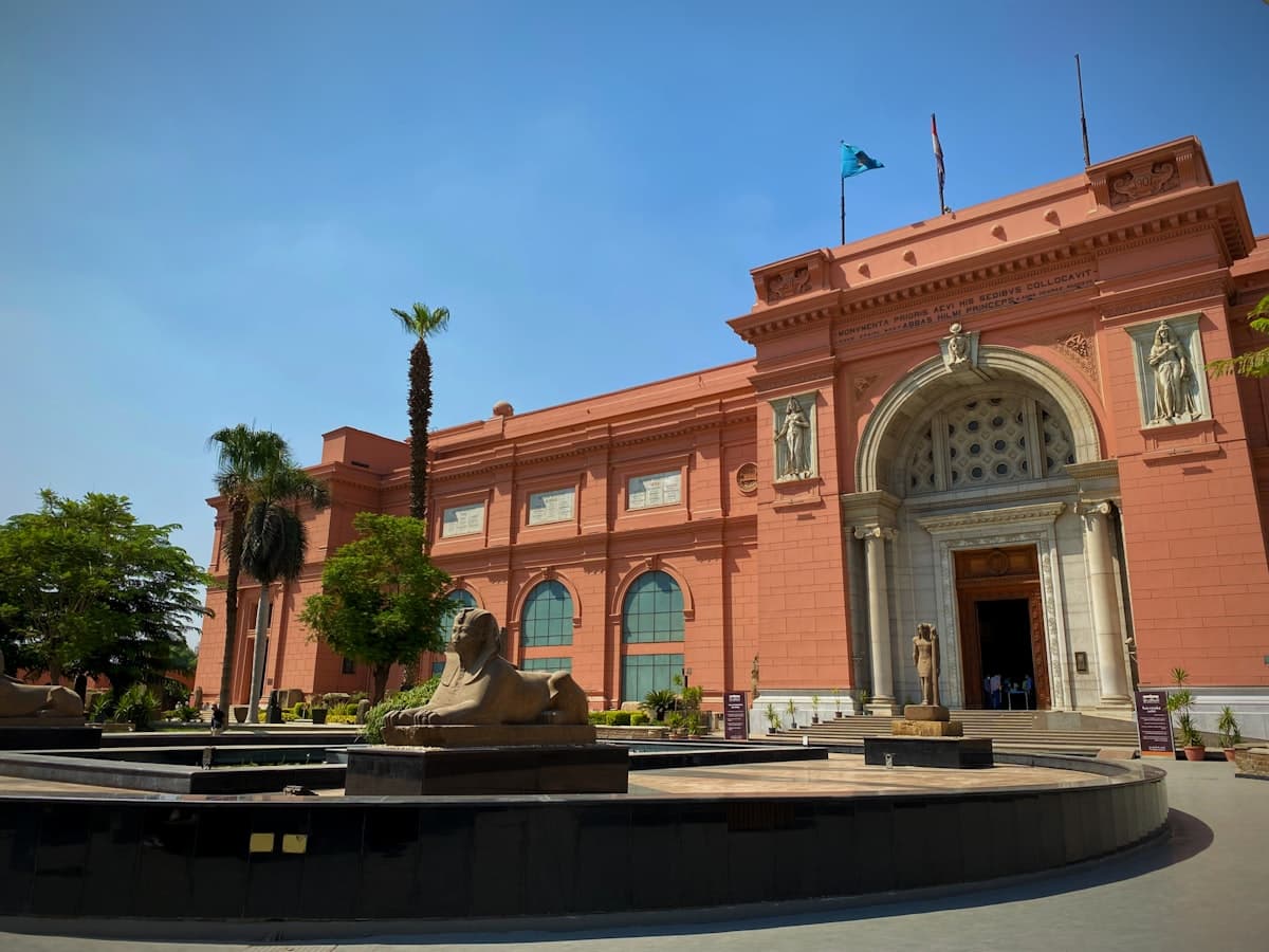 a large building with a fountain in front of it