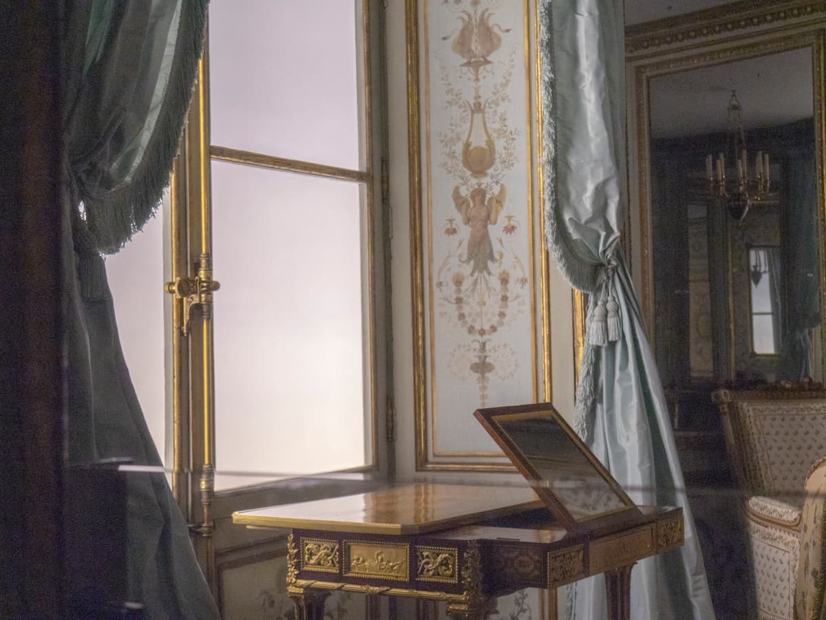 a room with a table and a chair in it
